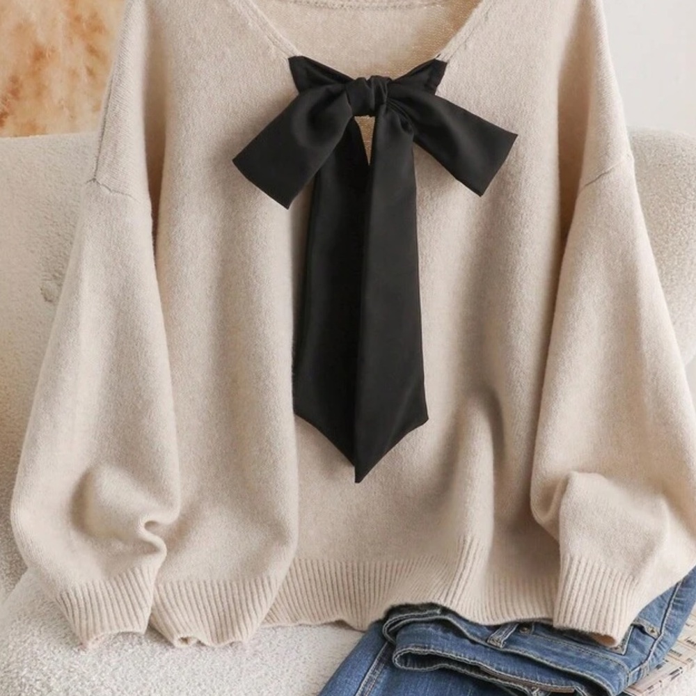 Chic Beige Sweater with Black Bow